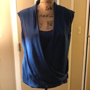 Draped neck blouse with attached middle insert.